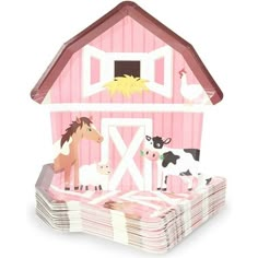 a pink barn with horses and cows on it's roof is set against a white background