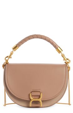 Stirrup-inspired hardware furthers the equestrian aesthetic of this updated version of Chloé's iconic Marcie saddlebag, here crafted in colorblocked leather. A wrapped top handle and chain shoulder strap—both removable—offer styling options for the chic look. Magnetic-snap flap closure Removable top carry handle; removable chain shoulder strap Interior wall pocket Leather Made in Italy Designer Handbags This brand has B Corp certification, representing business practices with emphasis on social Chloe Crossbody Bags, Sac Marcie Chloe, Chloe Small Marcie Bag, See By Chloe Mara Bag, Chloe Mara Bag, Chloe Handbags Marcie, Orange Tote Bags, Louis Vuitton Sarah Wallet, Cowhide Purse