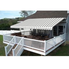 a white deck with an awning over it