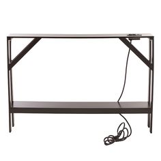 a black shelf with an electric cord connected to it