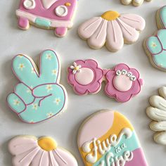 decorated cookies are displayed on a table