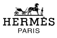 the logo for herme's paris, which is located in front of a horse drawn carriage