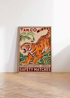 a poster with an image of a tiger on it's back and the words tamco