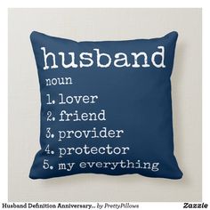 a blue pillow with the words husband written in white on it, and an image of a