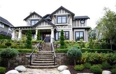 a large house with stone steps leading up to it