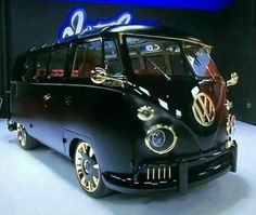 the vw bus is painted black and gold