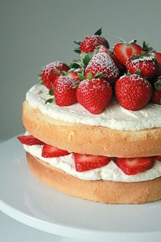 two layers of cake with strawberries on top