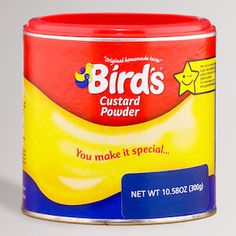 a can of bird's custard powder sits on a wooden table top