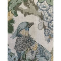 a blue bird sitting on top of a flower covered wallpaper next to a tree