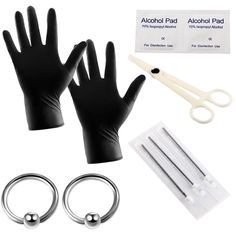 a pair of black gloves and two pairs of scissors