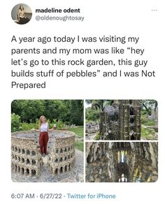 a woman standing in front of a stone structure with words written on it and pictures of the