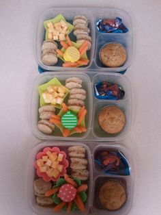 four plastic containers filled with food on top of a white countertop next to each other