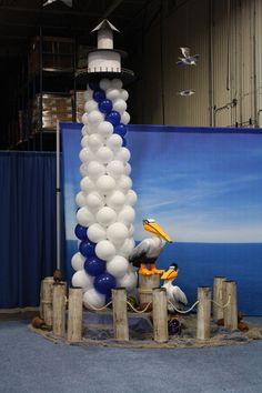 a large balloon sculpture in the shape of a pelican with a bird on it