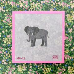 an elephant cross stitched on top of a flowery background with pink trimming