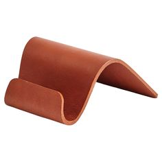 a brown leather seat cushion on a white background