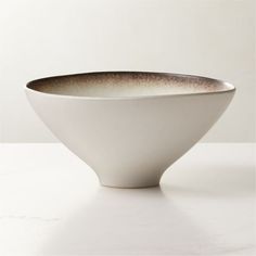 a white bowl sitting on top of a table