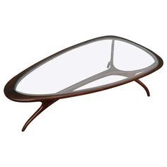 an oval glass table with wooden legs and a metal frame on the top, against a white background