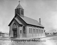 an old black and white photo of a church