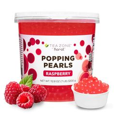 raspberry flavored tea in a plastic container next to fresh raspberries