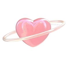 a pink heart shaped ring on top of a white background