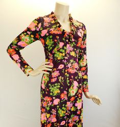 "Vintage 70s long sleeve floral maxi dress, deep wine with pink and orange floral. Sweet 70s maxi dress with long sleeves with ruffled V neck and hem. Full metal zipper in the back. It has a fitted bodice and drapes beautifully. I believe it's a polyester blend and does have some stretch to it. Measured flat  Shoulders 15\" Sleeve 22\" Underarms 16\" 32\" bust waist 14\" 28\" waist Hips 18\" 36\" hip Length 54\"" Long Sleeve Floral Maxi Dress, Maxi Dress With Long Sleeves, 70s Maxi Dress, Dress With Long Sleeves, Mod Dress, Pink Maxi Dress, Full Metal, Metal Zipper, Floral Maxi