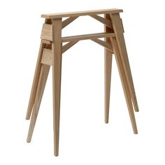 a small wooden table with three legs and one leg extended to the side, on a white background