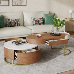 a living room with white couches and coffee table in the center, surrounded by green pillows