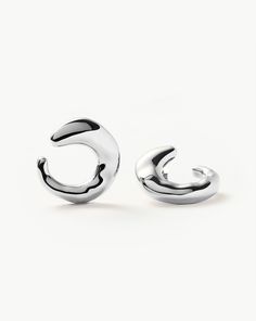 Molten Large Open Stud Earrings | Silver Plated. These Large Molten Open Studs are Designed to Wrap Around Your Ear Lobe. Let Them Take Centre Stage or Style with Mini Hoops and Studs for an Instant Ear Stack. Metal: Rhodium Plate on Brass Weight: 7. 6g Dimensions: 24. 5mm X 24. 5mm Product Code: Or-S-E4-Ns Gold And Silver Earrings, Mens Diamond Bracelet, Diamond Initial Necklace, Stud Earrings Silver, Coin Pendant Necklace, Leaf Bracelet, Ear Stack, Centre Stage, Diamond Gift