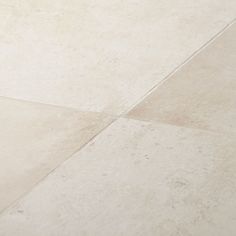 a skateboard is laying on the ground in front of a white tiled flooring