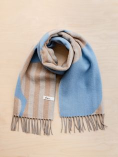 This scarf does all the work so you don't have to. Effortlessly elevate your scarf with this TBCo scarf featuring a floral and striped pattern in blue, camel and grey. It's woven from 100% breathable lambswool, and its cosy, oversized fit will keep you warm through the seasons. Materials: Fibre, 100% Lambswool. Size: 20" x 79" / 50cm x 200cm, including fringing Care: Handwash. Lay Flat to Dry. Designed in Edinburgh Studio. Alpaca Blanket, Luxury Gifts For Her, Sleep Accessories, Cashmere Blanket, Pajamas Gift, Inner Mongolia, Triangle Scarf, Oversized Scarf, Cotton Scarf