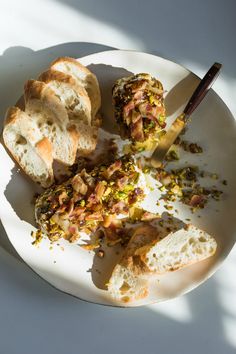 a white plate topped with pieces of bread