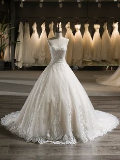 a wedding dress on display in a bridal shop