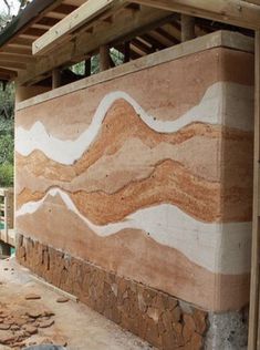 an outdoor area with stone and wood in the background