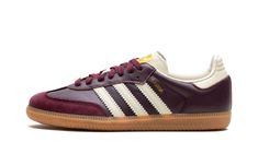 The Women’s adidas Samba OG “Maroon/Cream White” is a women’s-exclusive colorway of the classic indoor soccer shoe with a maroon-based appearance.  The upper features a maroon leather base with a tonal suede overlay on the toe.  Cream White Three Stripes branding appears on both sides, while a gold “Samba” logo can be found on the lateral side of the midfoot.  Gold adidas branding appears on the Cream White tongue.  Underfoot, a gum rubber sole rounds out the look. Adidas Shoes Samba, Jordan Golf, Nike X Travis Scott, Adidas Samba Og, Maroon Leather, Adidas Spezial, Nike Dunk High, Adidas Campus, Mens Uggs