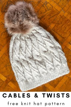 cable knit hat with faux pom - pom on top and text that reads cables & twists free knitting pattern