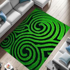 a living room with a green rug and white couches