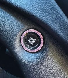 an engine start button on the dashboard of a car