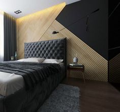 a bedroom with a large bed in the corner and a black headboard on the wall