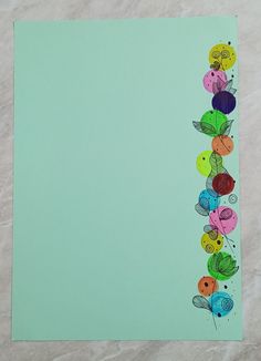 the paper is decorated with colorful buttons