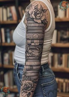 a woman's arm with books and roses tattooed on her arm, in front of a book shelf