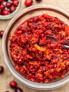 cranberry sauce in a glass bowl with spoon