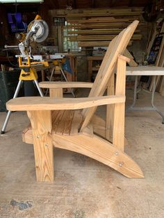 a bench made out of wooden planks in a workshop with a circular sawhorse