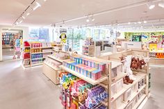 the inside of a toy store filled with lots of shelves and toys on top of each shelf