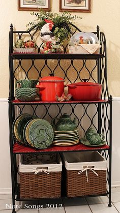 a metal shelf filled with dishes and plates