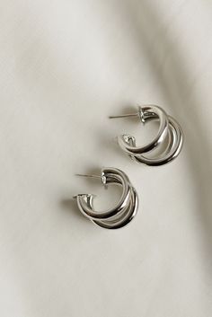 Classic + stylish -- our Triple Hoop Earrings are versatile for everyday wear. Whether they are dressed up or down, they make the perfect accessory. Available in both gold + silver. Includes two gold or silver plated triple hoop earrings Size Diameter: 20mm Width Diameter: 15mm All materials are lead & nickel free Silver Gold Earrings, Triple Hoop Earrings, Everyday Wear Jewelry, Bracelets Jewelry, Accessories Jewelry Earrings, Jewelry Companies, Dream Jewelry, Earrings Collection, Ear Jewelry