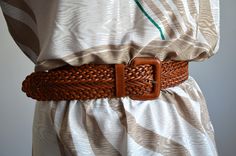 Vintage ESPRIT wide brown braided belt, from the 1990s era Women's brown woven leather belt with a leather-covered belt buckle and 1  leather loop. Perfect over a dress or an oversized shirt or a dress Size - 80 cm which is 31.5 inches Length (measured from the edge of the belt buckle to the end of the braided part and does not include the belt buckle) - 37 inches / 94 cm. Width of the leather strap - 2 inches / 5 cm Condition: Very good vintage condition with a some scratches on the leather buc Casual Brown Belts For Summer, Casual Brown Summer Belts, Bohemian Brown Belts For Summer, Bohemian Brown Rope Belt, Retro Brown Adjustable Belt, Hippie Belt, Vintage Esprit, Braided Belt, Genuine Leather Belt