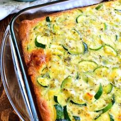 a casserole dish with zucchini and cheese