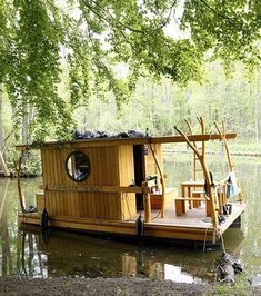 a house boat floating on top of a body of water