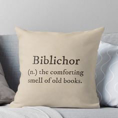 a pillow that says, biblichor in the comforting smell of old books