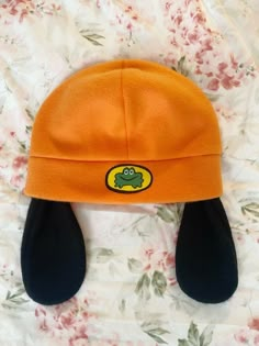 A soft, fleece beanie made to resemble Parappa's from Parappa the Rapper ! (*' The hat and ears are made entirely of fleece, and the logo is printable fabric paper. These hats are one size fits most! The band at the bottom measures about 24 inches all around, so if you need your hat to be bigger or smaller than that, please write it in your order notes. There are also options for a hat with no ears, or for one with squeakers in the ears ! If you would like your hat in a color other than the stan Dreamwastaken Hat, Target Kazoos, Fleece Beanie Hats, Bingus Christmas Hat, Beabadoobee Frog Hat, Fleece Frog Hat, Carsicko Hat, Pang Hat, Parrapa The Rapper